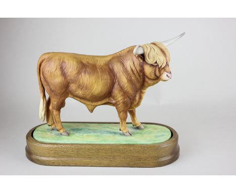 A Royal Worcester model of a Highland bull, modelled by Doris Lindner, limited edition 102/500, with plinth, certificate and 