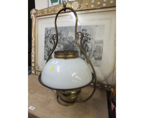 A TRADITIONAL BRASS HANGING OIL LAMP WITH GLASS SHADE
