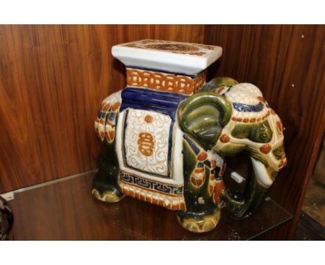 A LARGE DECORATIVE CERAMIC ELEPHANT STAND