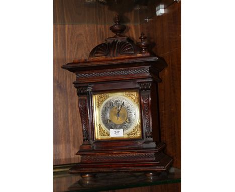 A SMALL BRACKET CLOCK WITH JUNGHANS MOVEMENT