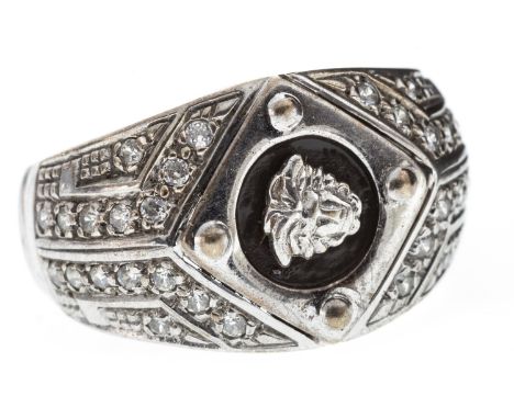 GENTLEMAN'S GEM SET RING, the bezel with central section of black hardstone and with white gems to the shoulders, in nine car