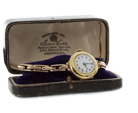EARLY TWENTIETH CENTURY NINE CARAT GOLD MANUAL WIND WATCH, the round white dial with Arabic numerals in black and red, outer 