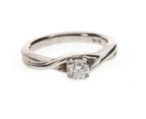 DIAMOND SOLITAIRE RING, the four claw mounted round brilliant cut diamond in a twist setting, marked 14K, size I 1/2, 4.4g