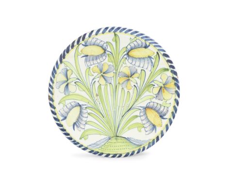 A London delftware Tulip charger, circa 1680Painted in attractive bright colours, four tulips and carnations growing from a g