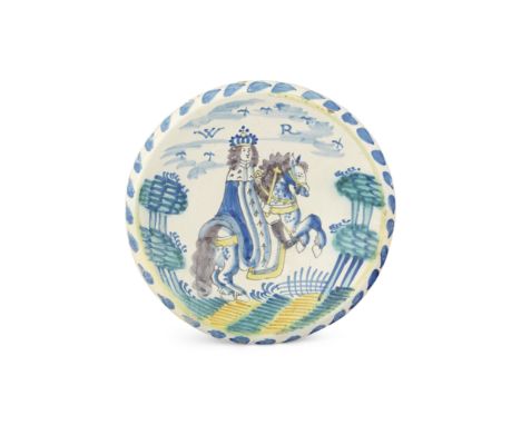 An English delftware Royal charger, circa 1690-1705Probably London, painted with an equestrian portrait of King William III, 