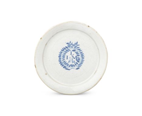 A London delftware marriage plate, dated 1688The centre painted in blue with a wreath encircling the initials and date 'L/ I 