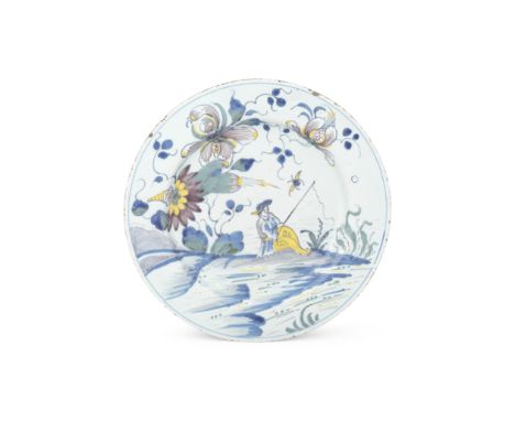 An attractive English delftware large dish, circa 1750Fully painted in blue, green, manganese and yellow with an angler seate