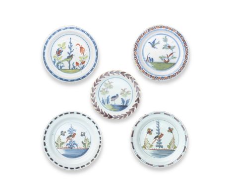 Five English delftware plates, circa 1720-50All probably London, comprising three plates painted in red, green and blue with 