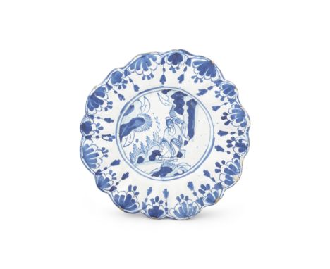 An English delftware dish, late 17th centuryLondon or Brislington, of press-moulded lobed form, painted in blue with a Chines