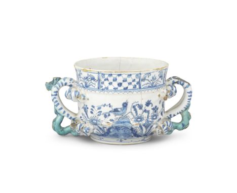An English delftware posset pot, circa 1685-1700Of small size, the elaborate handles with corkscrew terminals and serpent tai