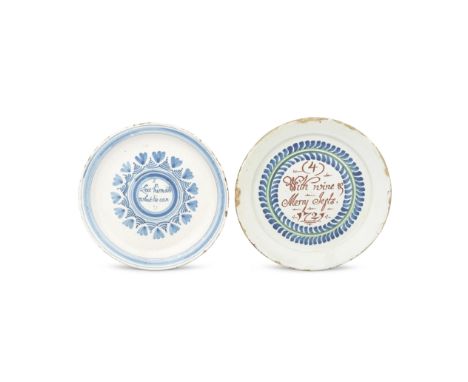 Two English delftware 'Merryman' plates, one dated 1721Comprising a polychrome example inscribed in red '(4) With wine &amp; 