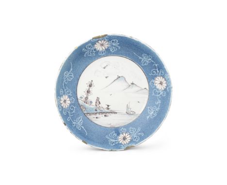 An English delftware saucer dish, circa 1750-60Probably London, painted in blue and manganese, the centre with a Chinese man 