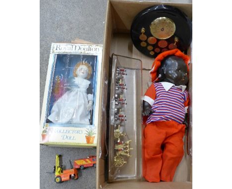 A doll, a Royal Doulton doll, a 1977 Queens Silver Jubilee coach and horses set and a novelty barometer