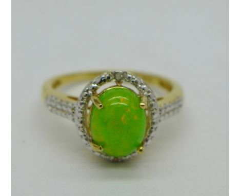 A silver gilt set green opal and diamond accents ring, O