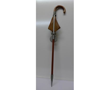 A shooting stick with inscribed silver mount, Presented to Capt. J.S. Sherwin, dated 1947