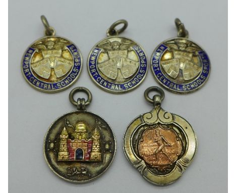 A silver, gold applied and enamel fob medal, Surrey County Football Association, 1930-31 Junior Charity Cup Winners, enamel a