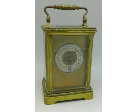A brass cased carriage clock, with case