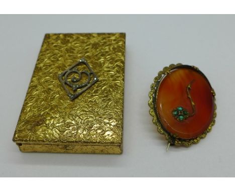 A late 19th Century brooch set with turquoise and an early 20th Century compact set with marcasite