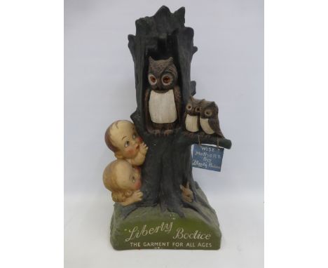 A rare Liberty Bodice "the garment for all ages" shop window illuminated display figure depicting two children beside a tree 