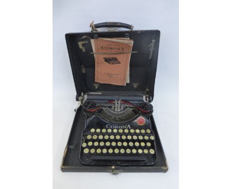 A 1920s Corona portable typewriter with original case and instruction manual.