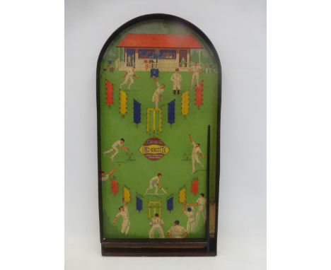 An Amersham Pin Cricket bagatelle board in good condition.