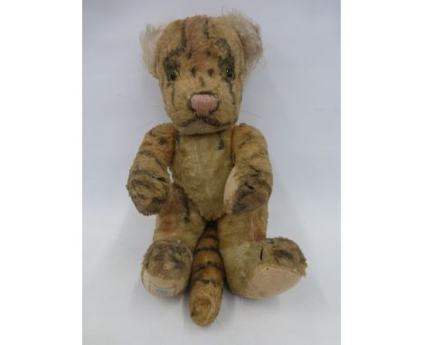 A Chad Valley teddy bear in the form of a tiger.