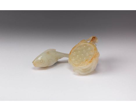 TWO CHINESE PALE CELADON AND RUSSET JADE CARVINGS 17TH/18TH CENTURY One formed as a lotus seed pod growing from a stem, with 