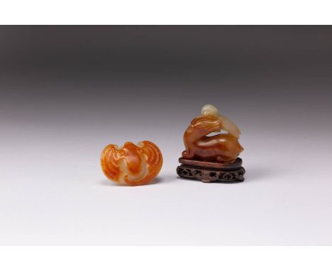 TWO CHINESE JADE CARVINGS OF AN ANIMAL GROUP AND A BAT 18TH CENTURY One carved as a recumbent beast with a bird picked out in