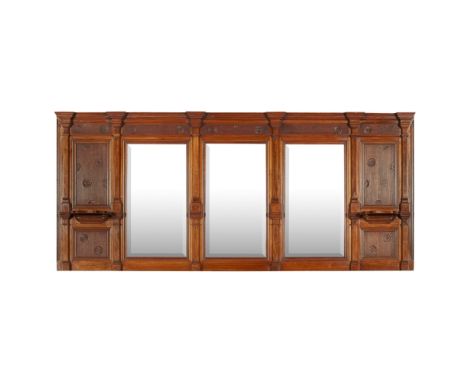 THOMAS JECKYLL (1827-1881)AESTHETIC MOVEMENT WALNUT OVERMANTEL, CIRCA 1875 the bevelled mirrors flanked by columns and carved