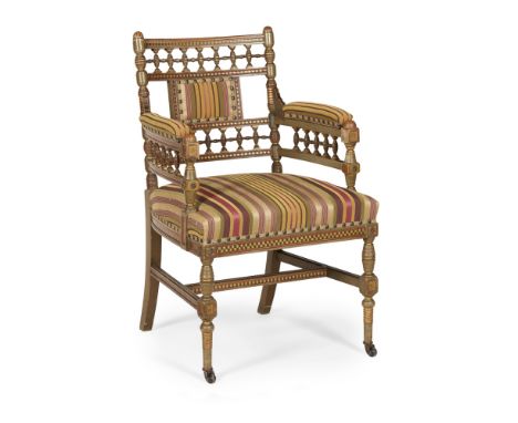 MANNER OF ALFRED WATERHOUSEAESTHETIC MOVEMENT PAINTED AND GILDED ARMCHAIR, CIRCA 1880 the turned fretwork back above open arm