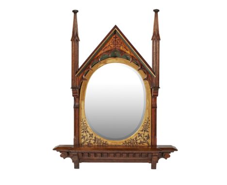 ENGLISH SCHOOLGOTHIC REVIVAL PAINTED OAK OVERMANTEL MIRROR, CIRCA 1865 the pedimented hooded top flanked by architectural fin