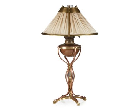 WILLIAM ARTHUR SMITH BENSON (1854-1924)ARTS &amp; CRAFTS BRASS AND COPPER TABLE LAMP, CIRCA 1900 the original brass framed sh