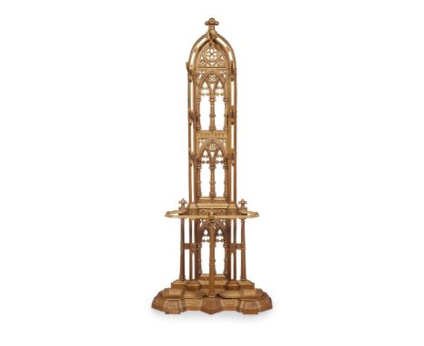 ENGLISH SCHOOLGOTHIC REVIVAL GILT OVERPAINTED CAST IRON HALL STAND, CIRCA 1873 of lancet fretwork design with three window fo