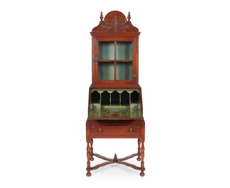 SCANDINAVIAN SCHOOLARTS &amp; CRAFTS WALNUT BUREAU CABINET, CIRCA 1910 the projecting cornice with arched cresting carved wit