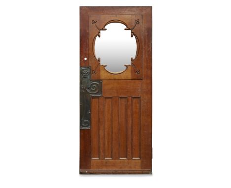 GLASGOW SCHOOL, ATTRIBUTED TO JOHN NISBET (1868-1951)ART NOUVEAU OAK DOOR, CIRCA 1900 with later central clear glass panel en
