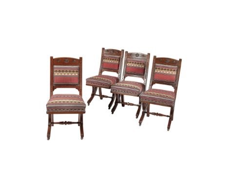 MANNER OF HENRY HOBSON RICHARDSONSET OF FOUR AESTHETIC MOVEMENT UPHOLSTERED OAK DINING CHAIRS, CIRCA 1890 each with scrolled 