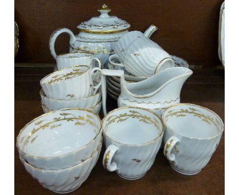 A Flight period Worcester tea and coffee service, circa. 1790, with white ground and gilt decoration, twenty pieces in total