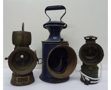 A Lucas King of the Road lamp, one other lamp marked Vitaphare and a signal lamp