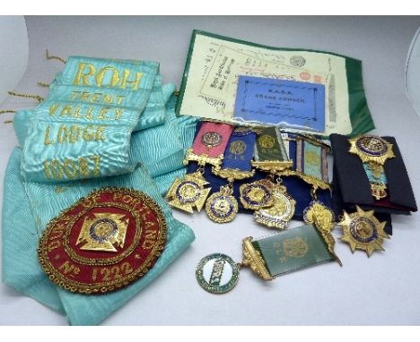 Masonic regalia including a sash, paperwork, eight medals including four silver