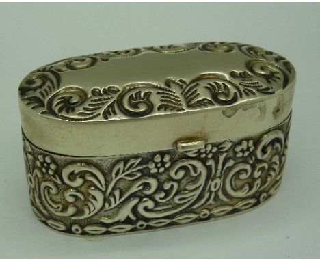 A modern white metal trinket box