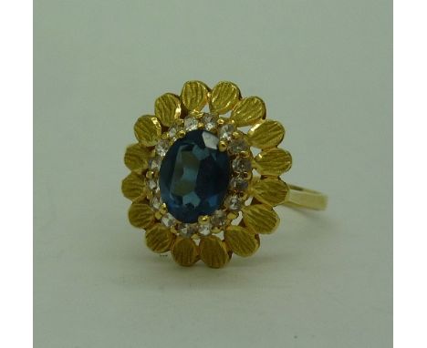 A yellow metal cluster ring, hallmarks worn, weight 3.5gms, size U