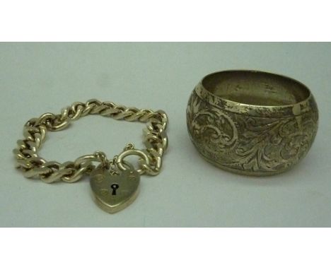 A silver bracelet and napkin ring, weight 53.9g