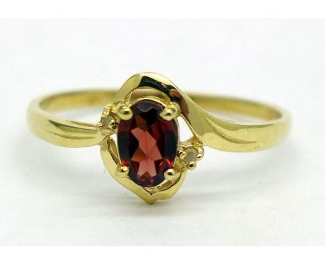 A 9ct gold, garnet and diamond ring, weight 1.1g, size O