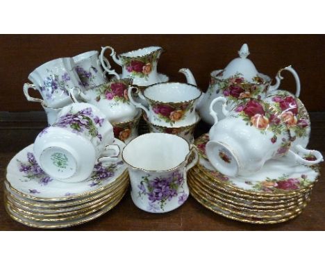 A Royal Albert Old Country Roses six setting tea set and six Hammersley Victorian Violets cups and saucers