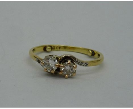 An 18ct gold, two stone diamond ring, weight 2.7g, size M