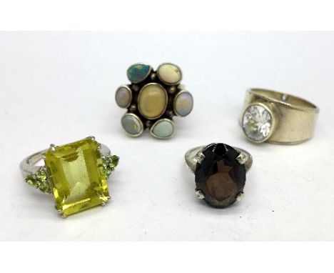 Three .925 silver rings and a white metal ring
