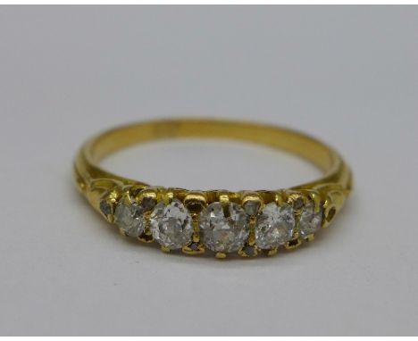 A yellow metal and five stone diamond ring, weight 2.6g, size O