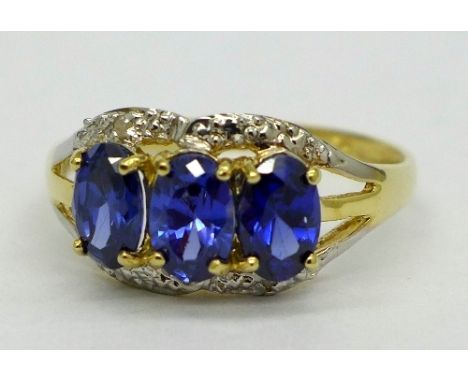 A 9ct gold, tanzanite and diamond ring, weight 1.8g, size O