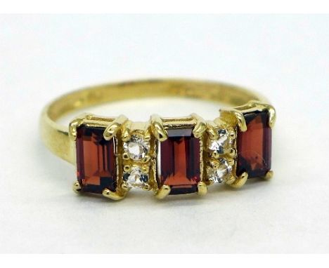 A 9ct gold, garnet and diamond ring, weight 1.5g, size O