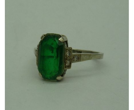 An 18ct gold, diamond and green stone ring, weight 2.9g, size N